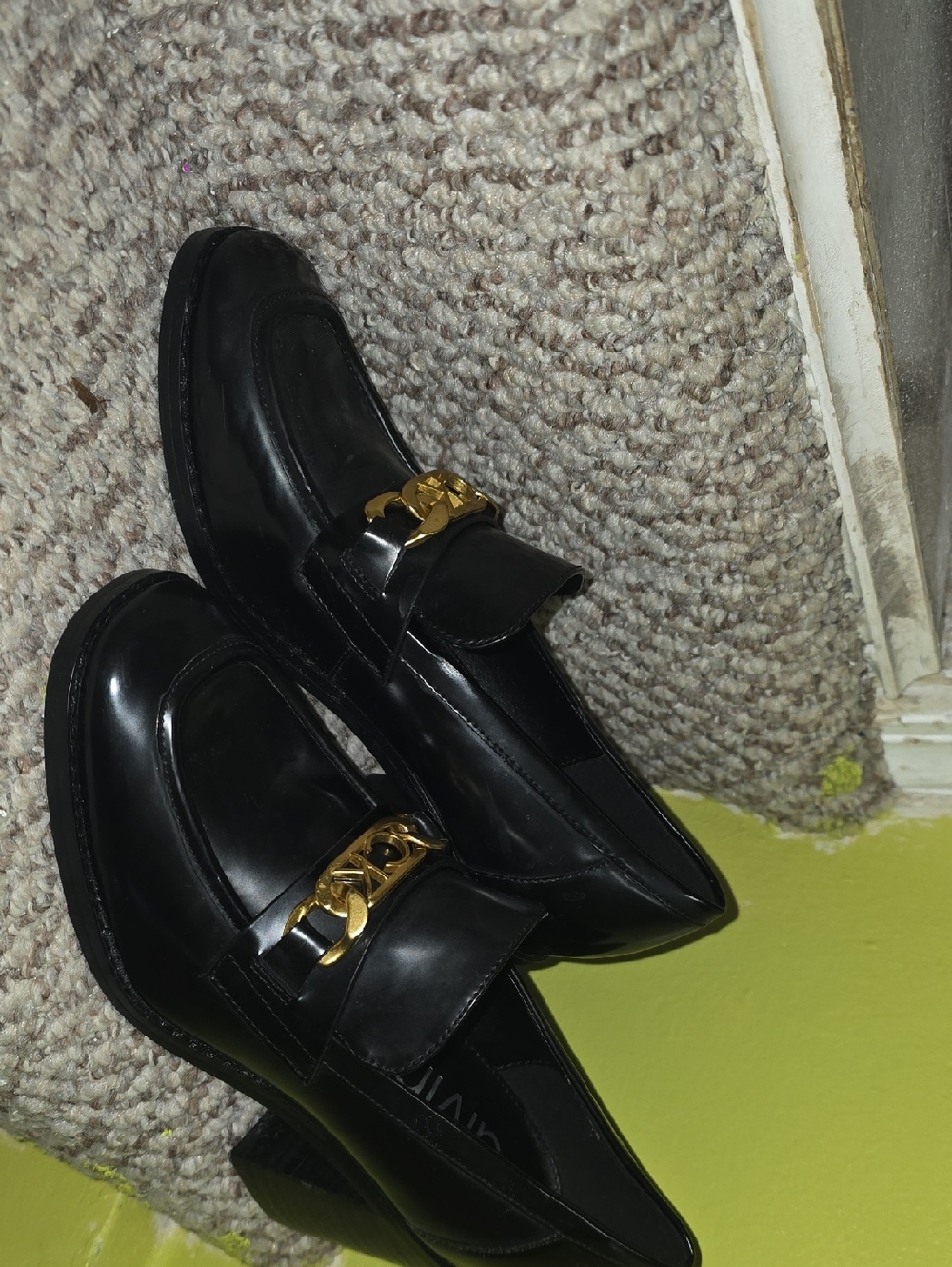 Calvin Klein Black Leather Loafers with Gold Chain Accent